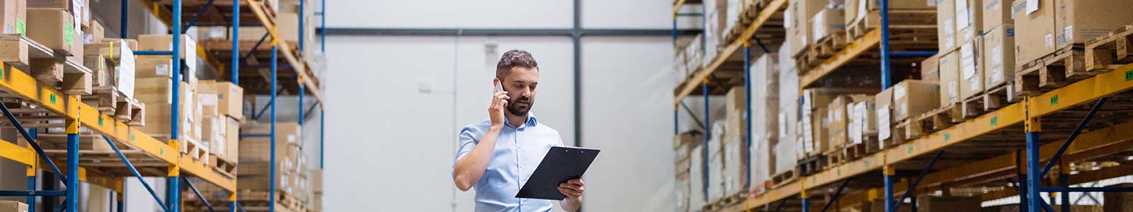 Warehouse worker or supervisor with a smartphone